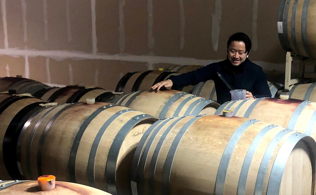 A colleague taking samples of the 2019 vintage. These samples are necessary when tracking the evolution of finished wine before bottling.