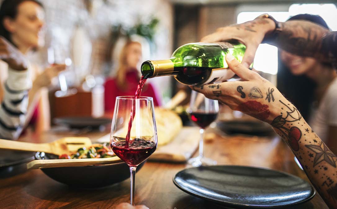 Man serving wine tattoos