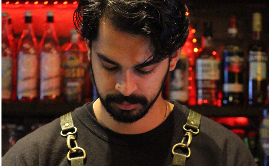 A person working behind a bar