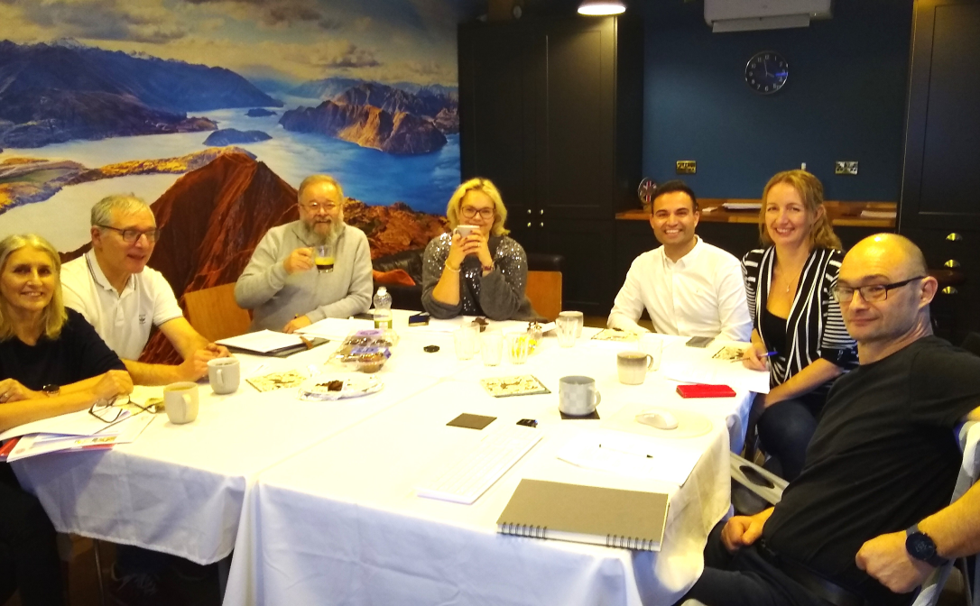 A group of people sitting around a table