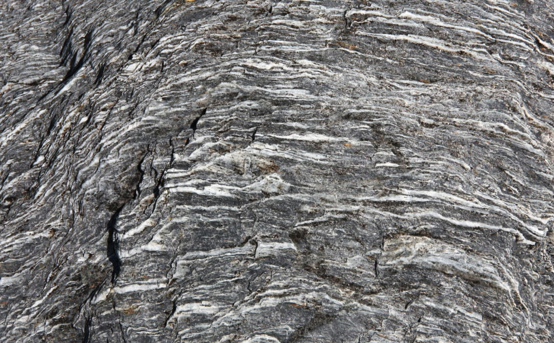 Closeup image of grey rock with sharp ridges