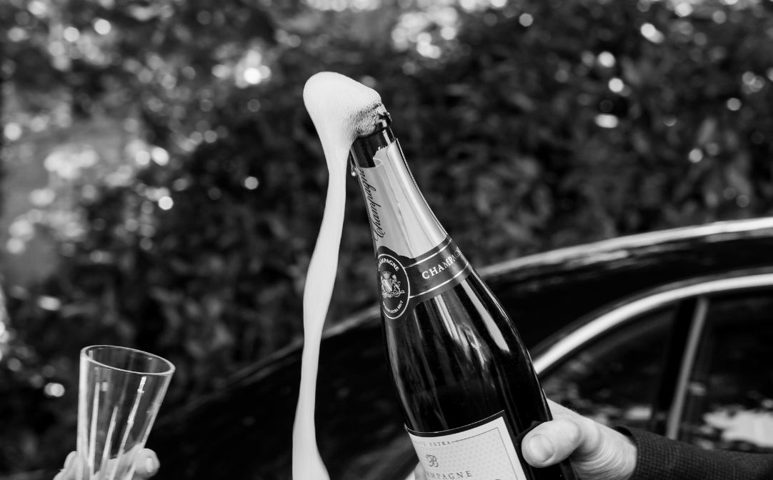 A bottle of Champagne pouring