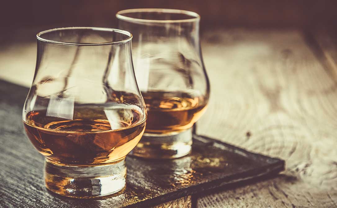 Whiskey or rum in glencairn glasses